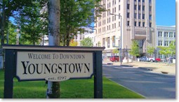 Daytime photo of Downtown as seen from Central Square, including "Welcome to Downtown Youngstown" sign.