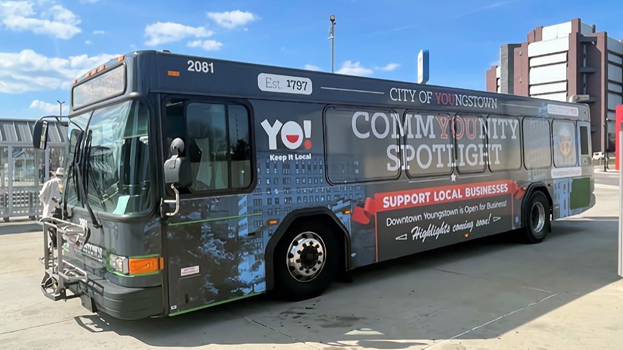Photo of ad-wrapped CommYOUnity Spotlight Bus.