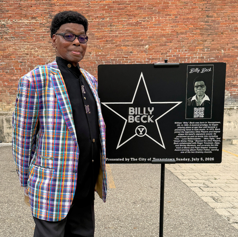 Billy Beck posing with his Walk of Fame plaque.