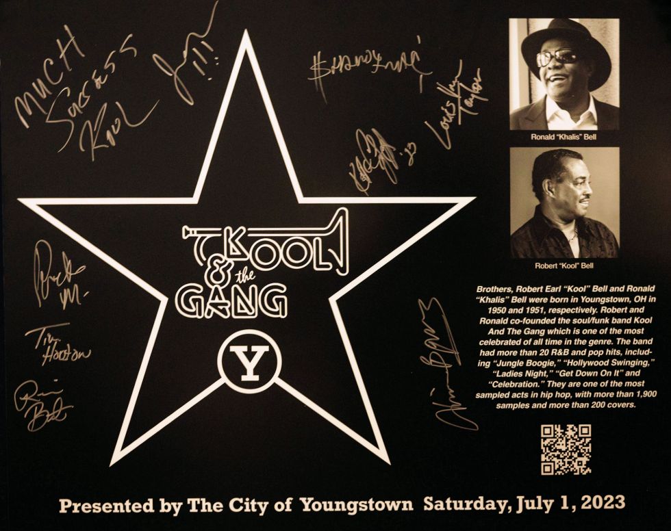Closeup of band-signed plaque replica. Photo Credit: Stephanie Sheronovich