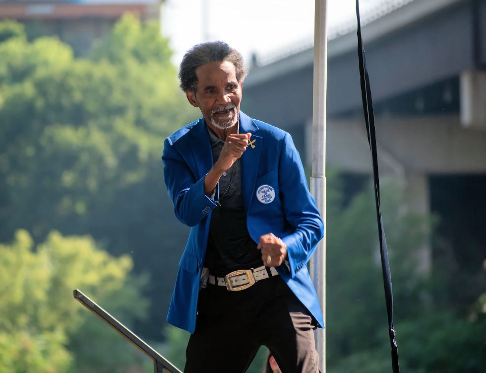 Greg Richardson strikes a boxing pose on stage, prior to the plaque unveiling ceremony. Photo Credit: McKee Foos Photography