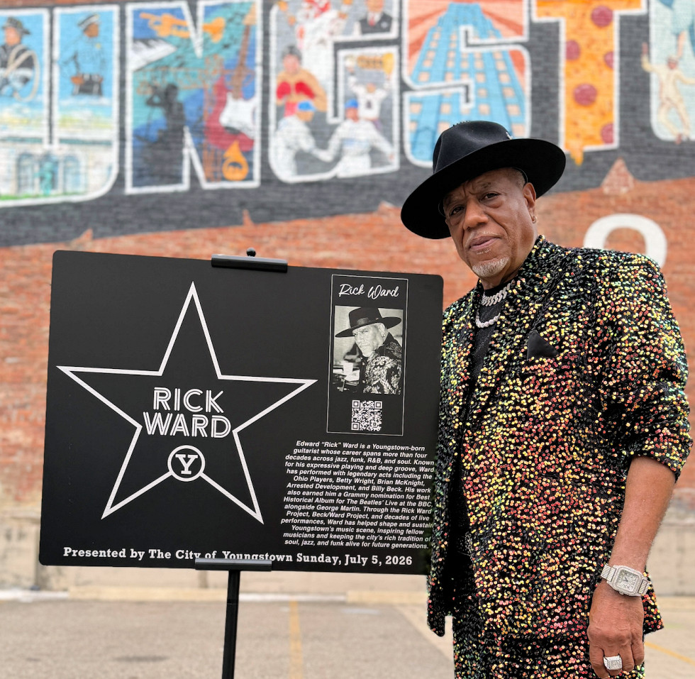 Rick Ward posing with his Walk of Fame plaque.