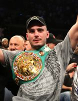 Photo of Kelly Pavlik in the ring with his championship belt over his shoulder, soon after his title fight.